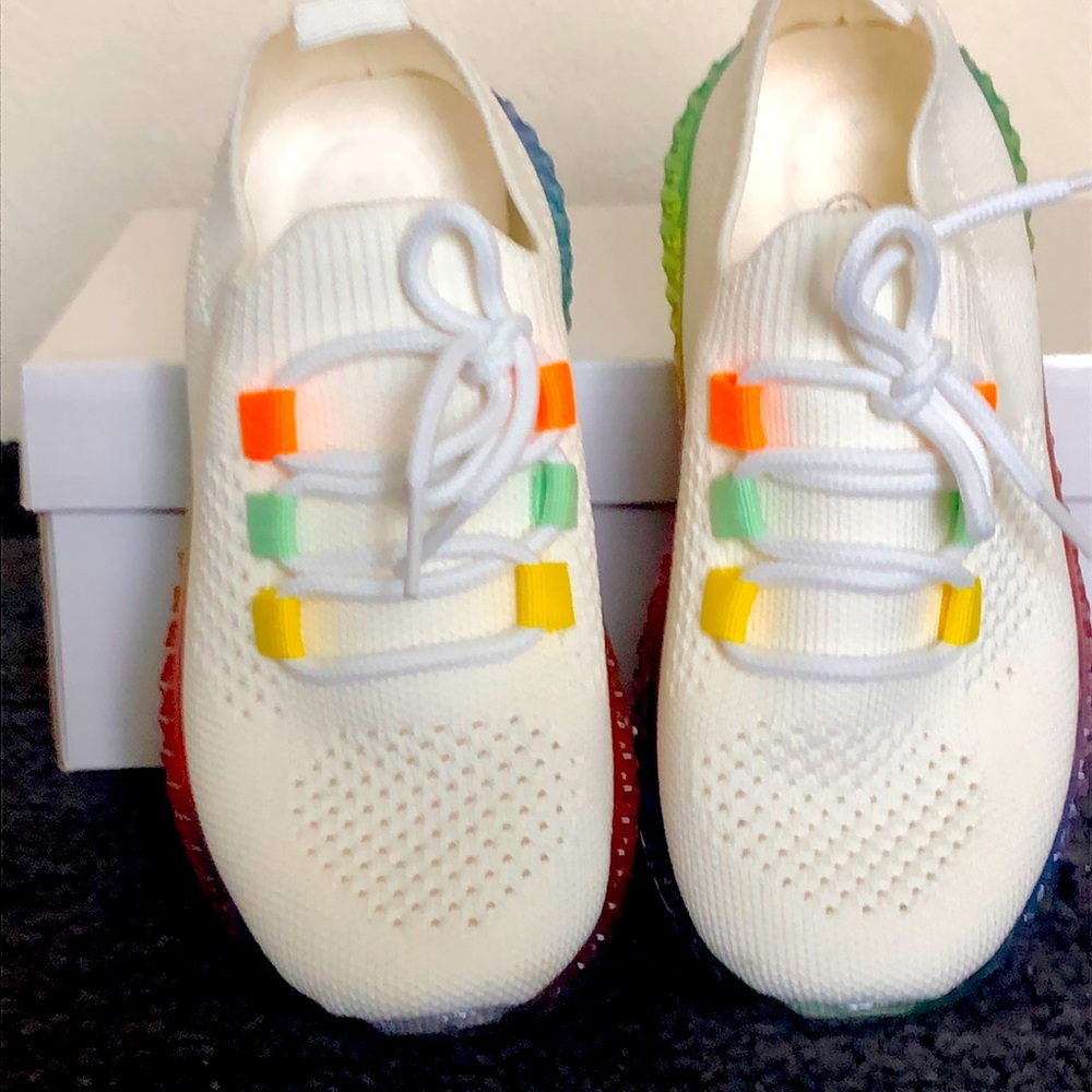 Tennis shoes, color white, size #13 , made with soft  fabric.